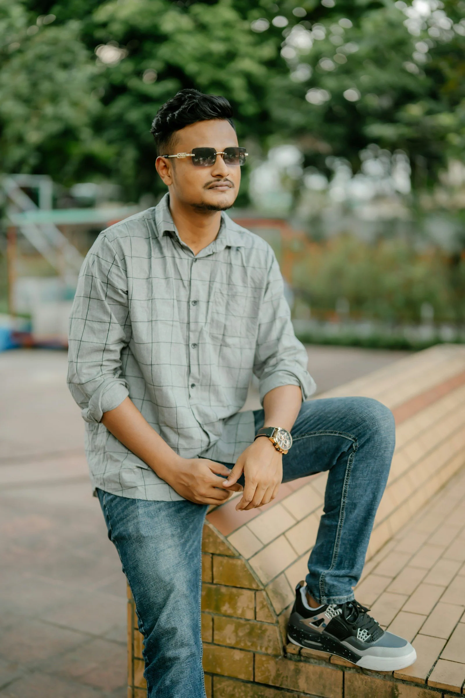 Man in plaid shirt leaning