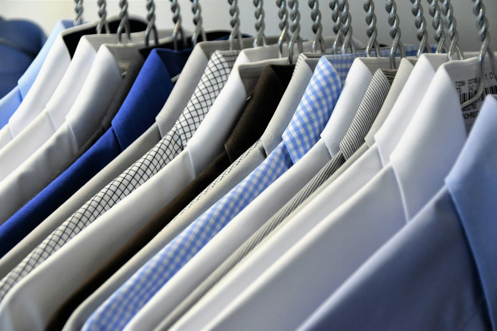 Hanged assorted color dress shirts