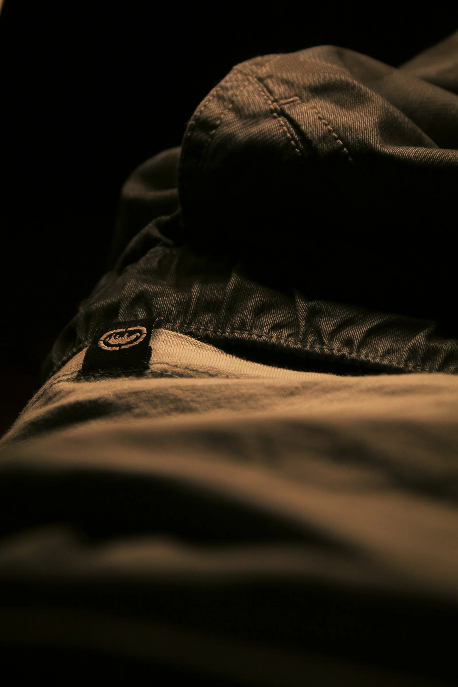 Grayscale photo of person wearing denim jeans