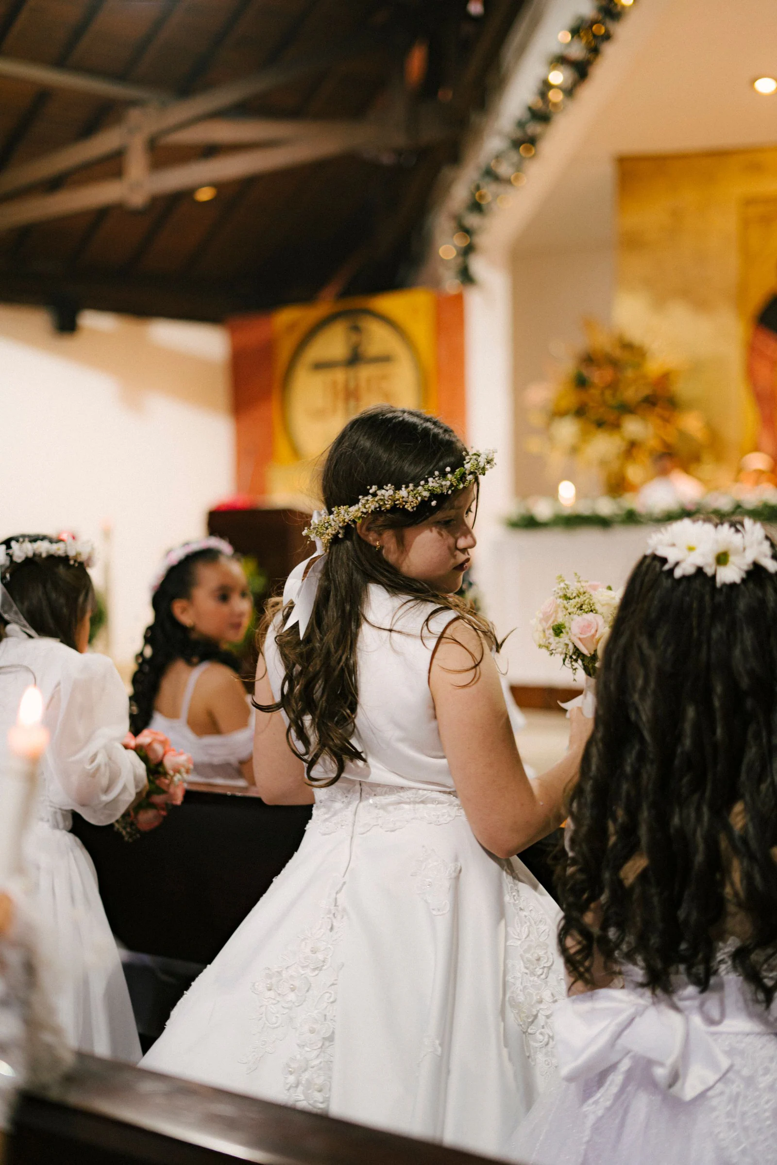 Young girls celebrating first communion in church