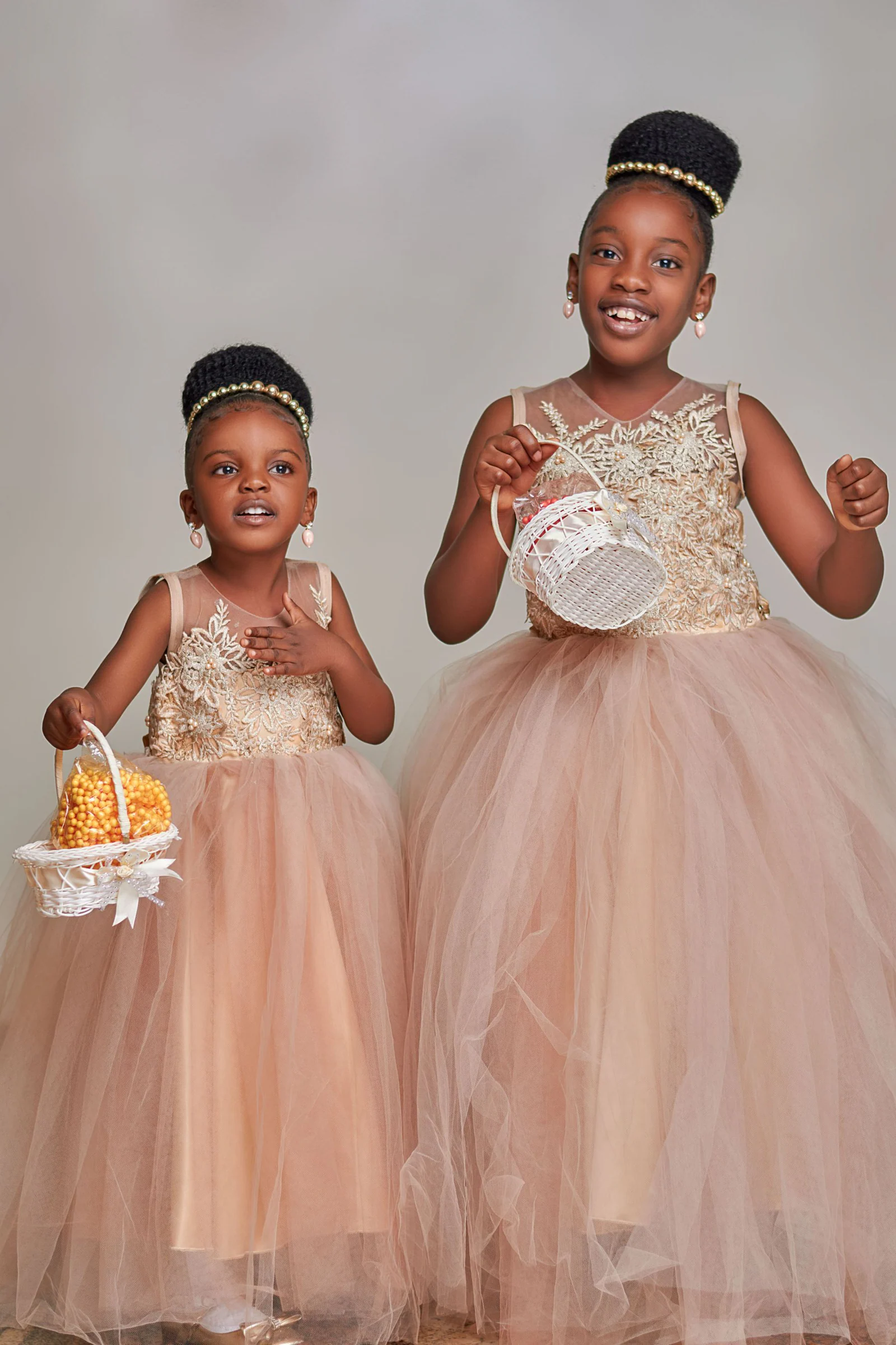 Two girl wearing elegant dresses