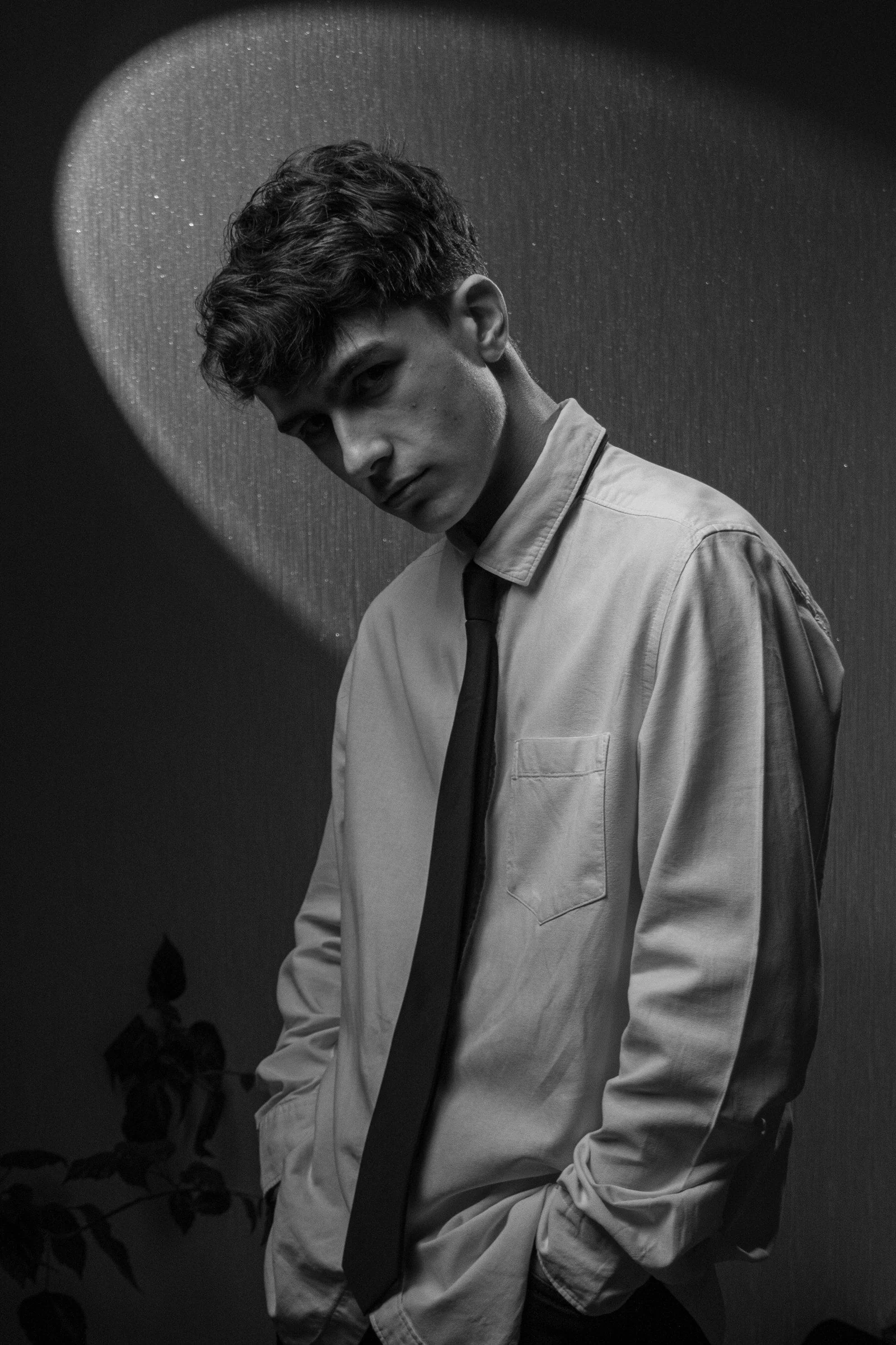 Young man in a white shirt and tie