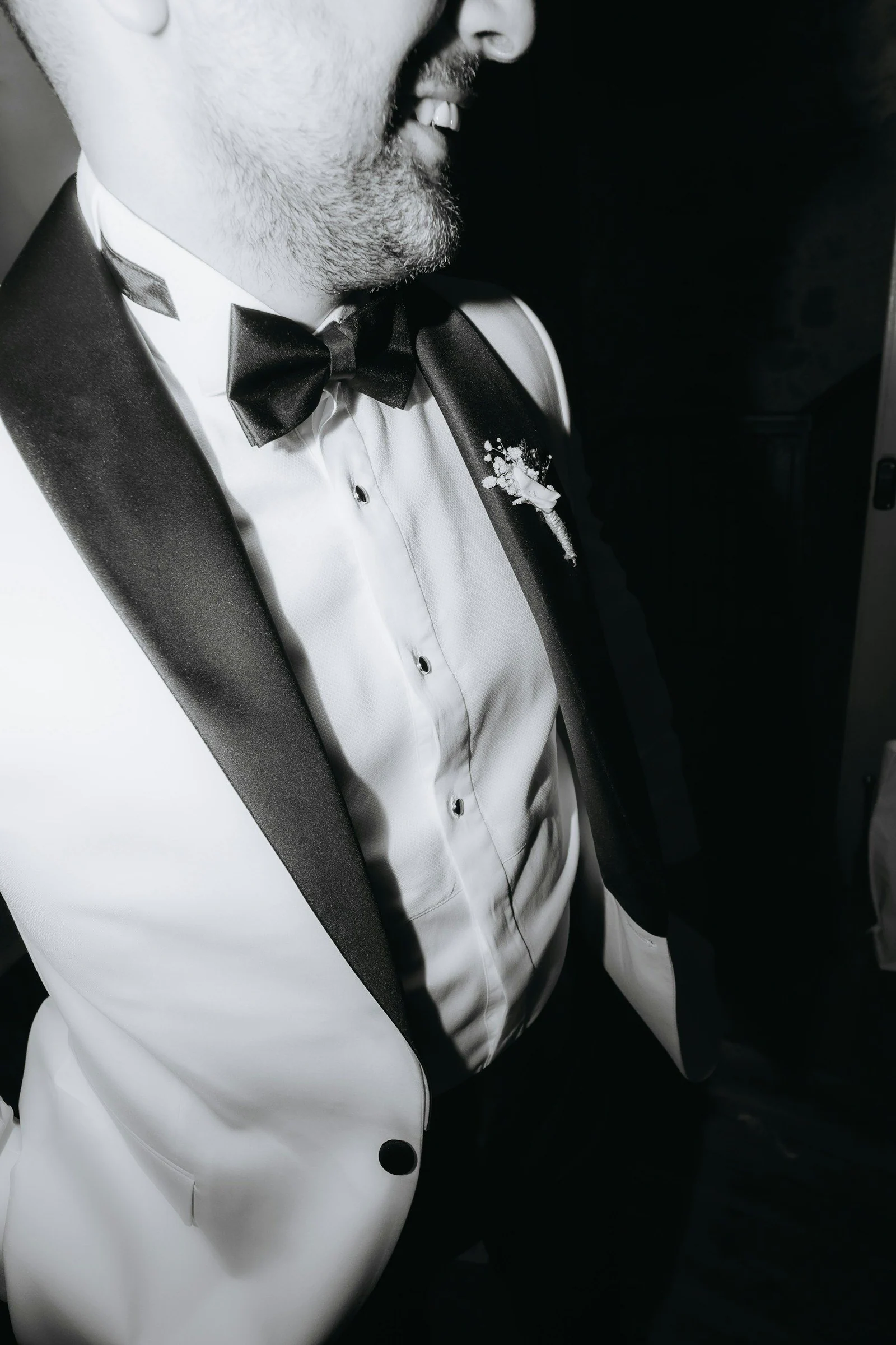 Man in white tuxedo jacket