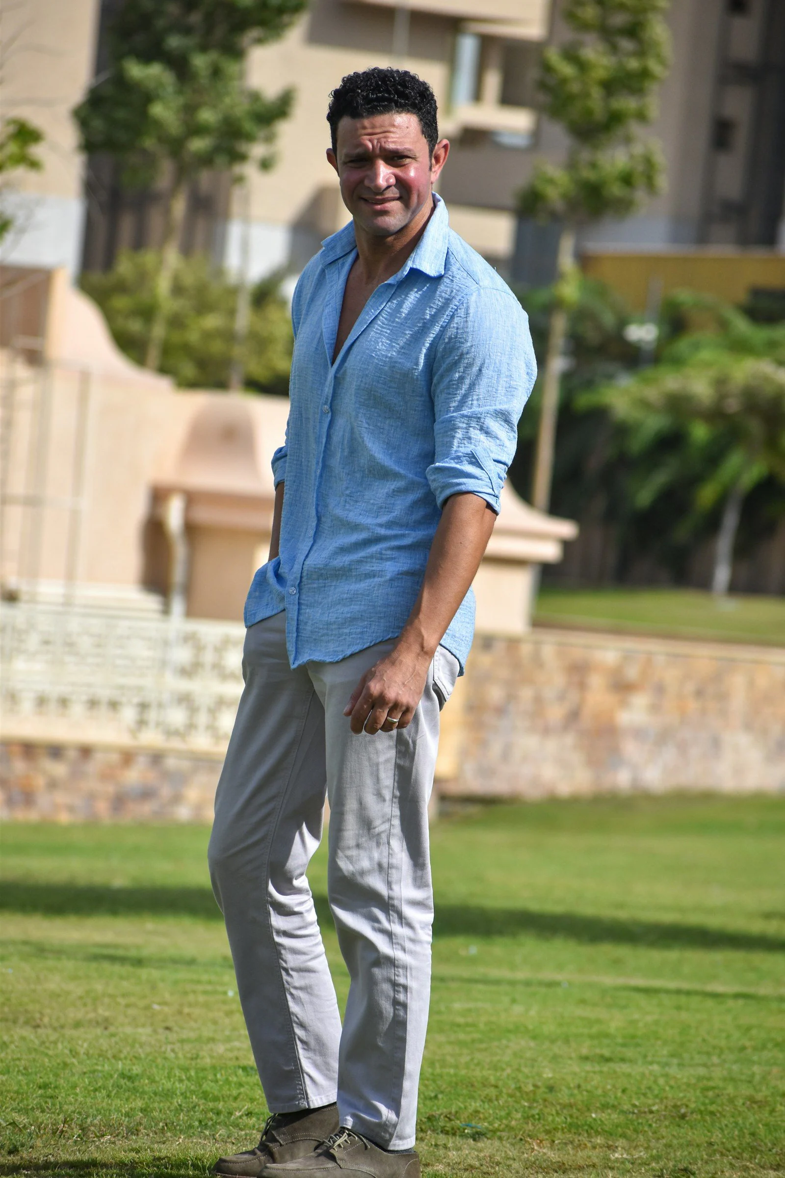 Man in blue shirt on lawn