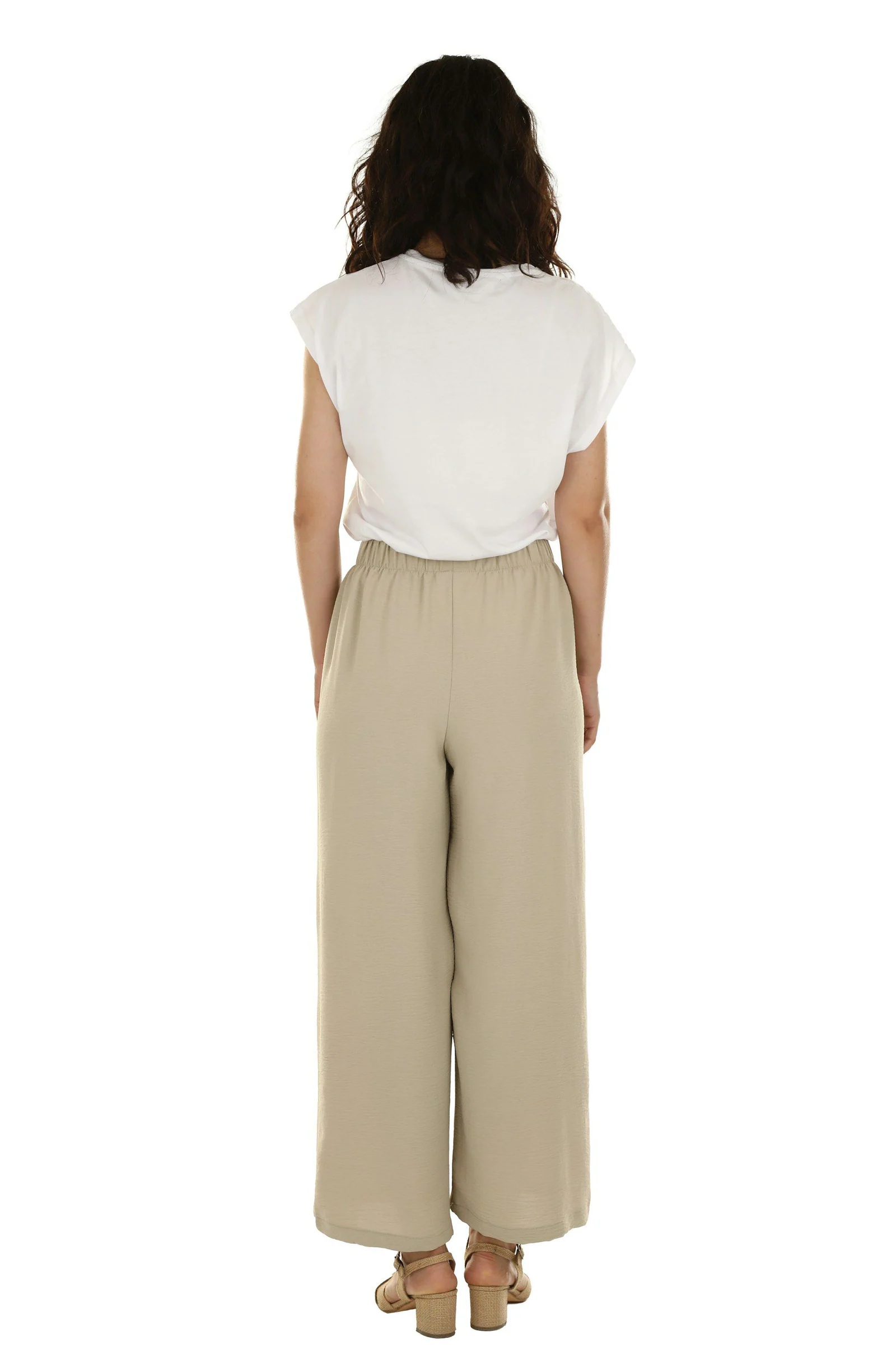 Woman in white shirt and trousers