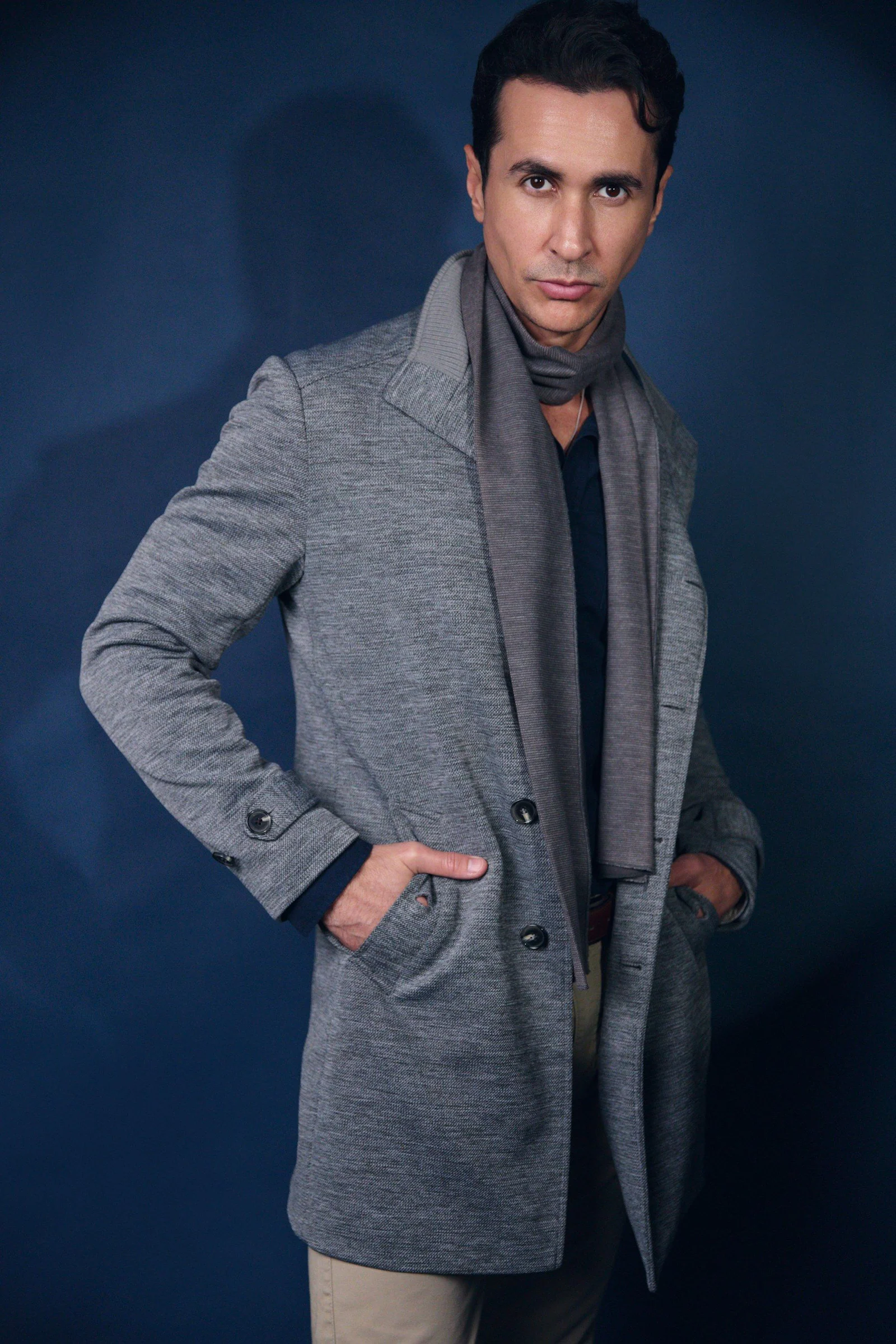 Man in grey coat and scarf