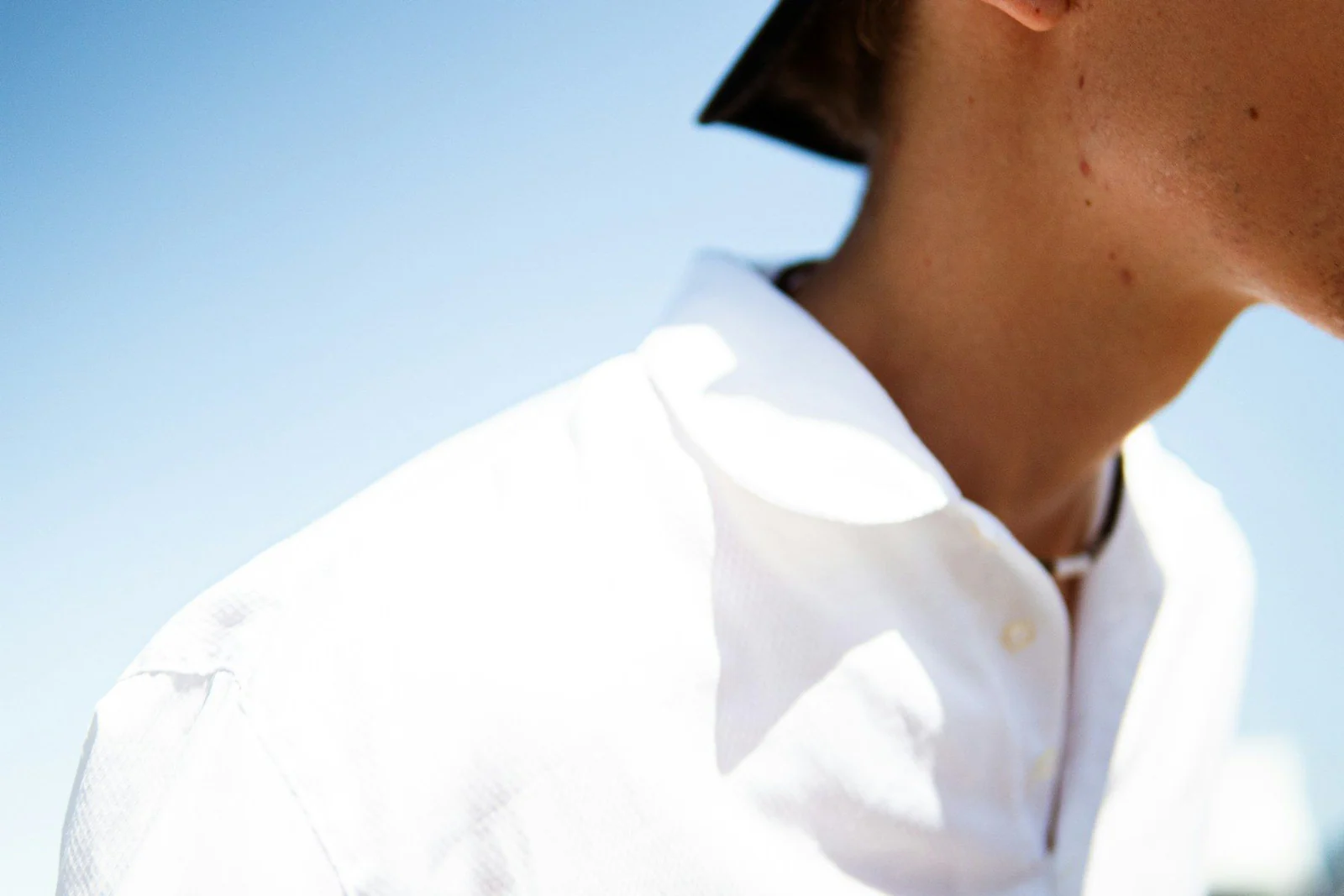 A man wearing a white shirt and tie