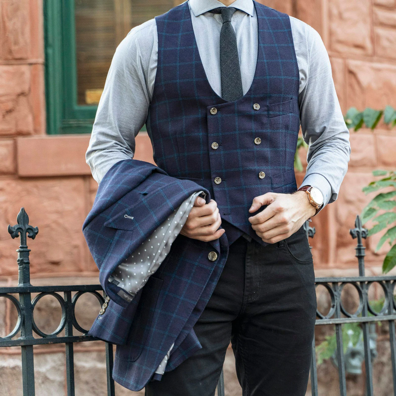 Man in blue vest and blue dress shirt