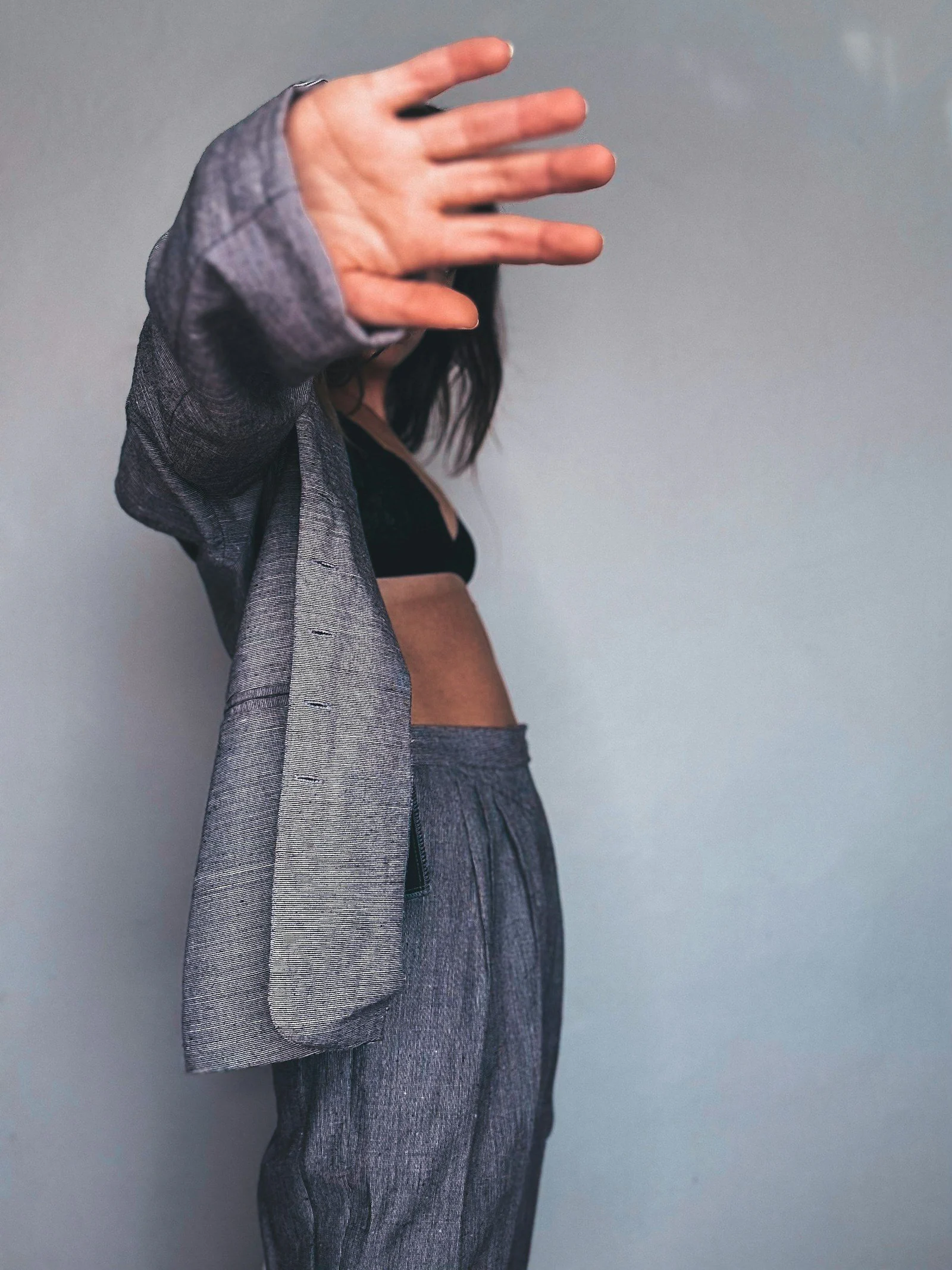 A woman with her hands up in the air