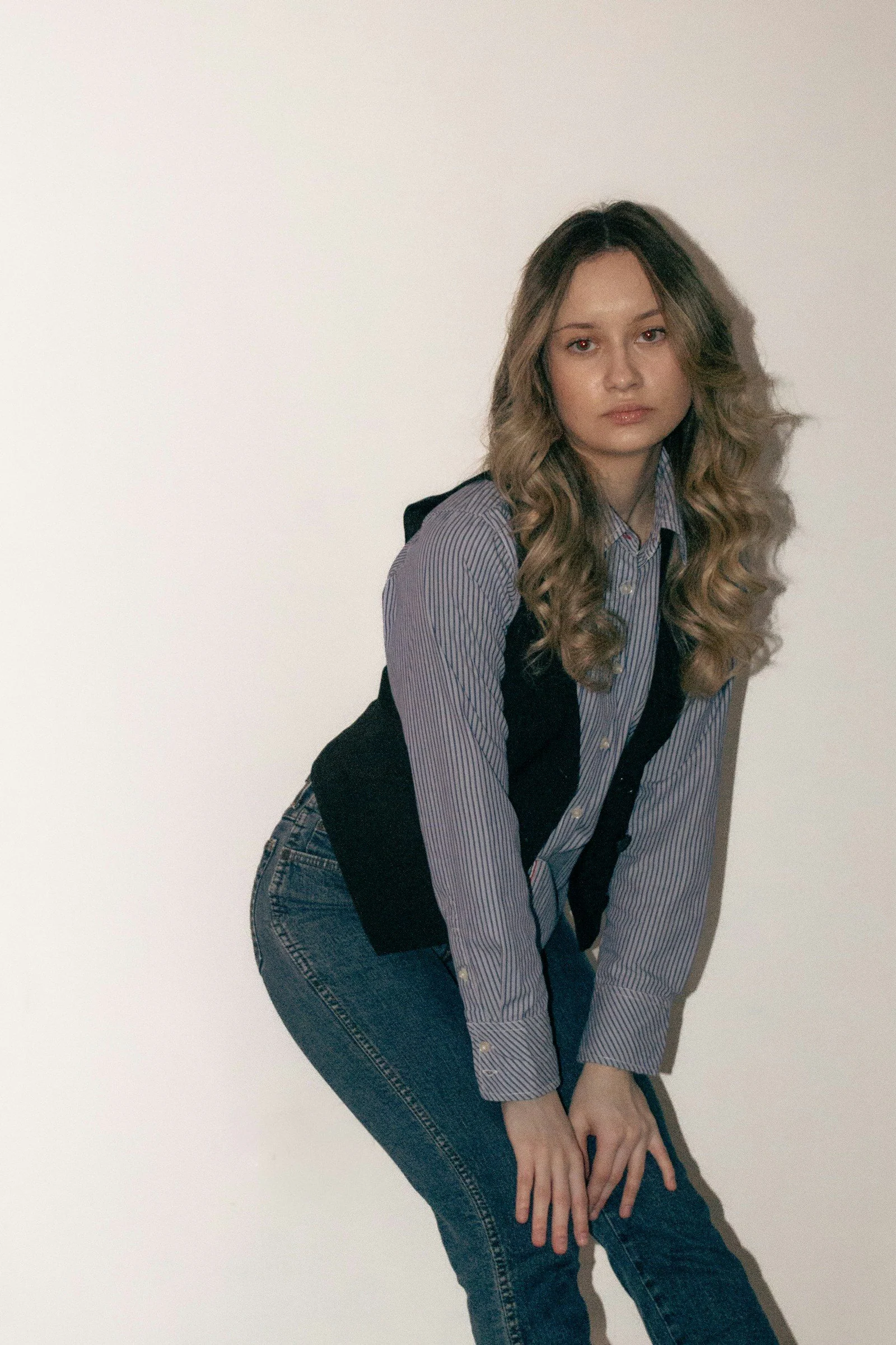 Young woman poses in casual attire