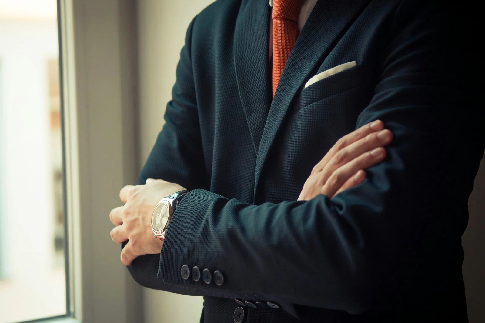 Close-up of a dark jacket sleeve with working cuff buttons