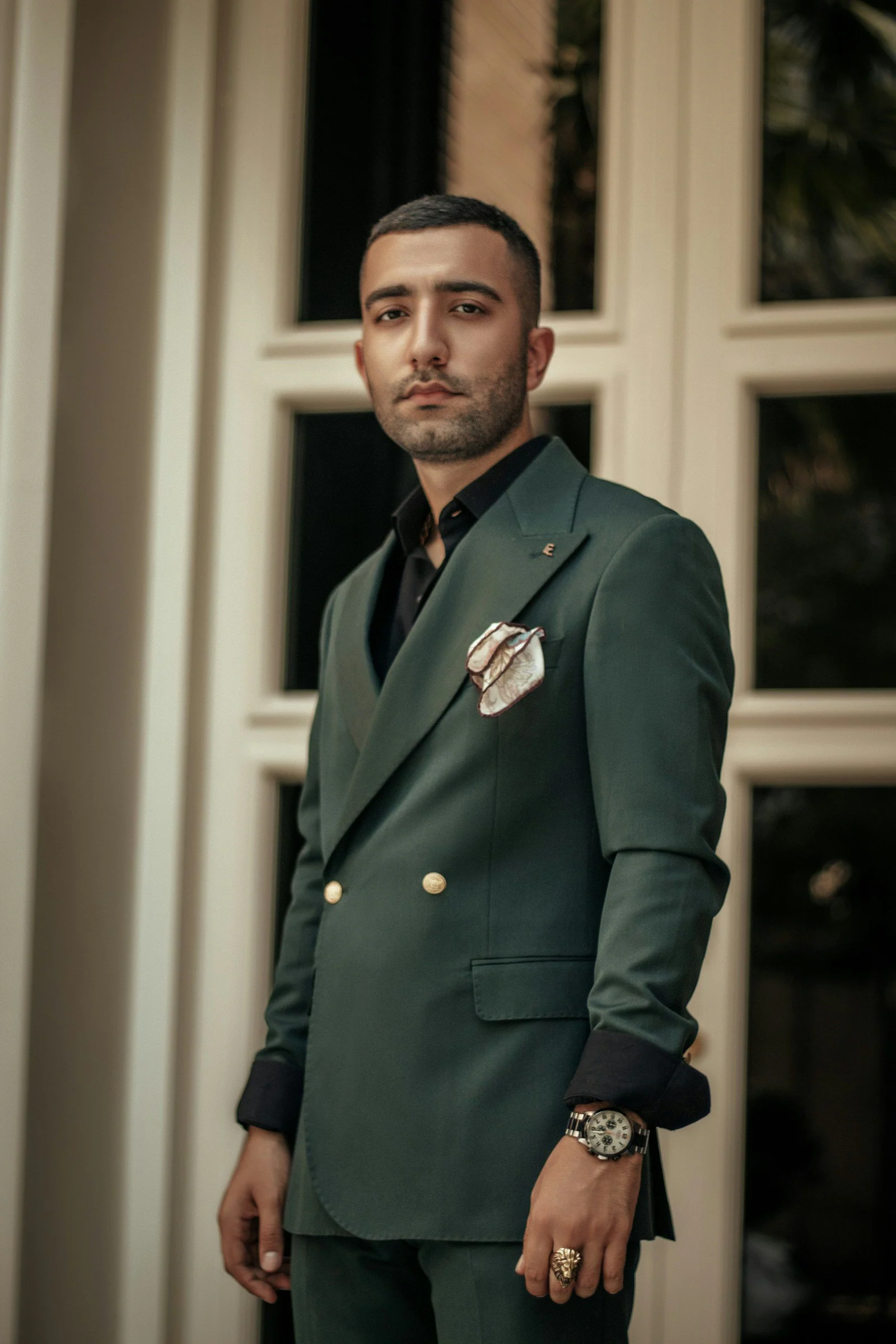 Green double-breasted suit with a pocket square