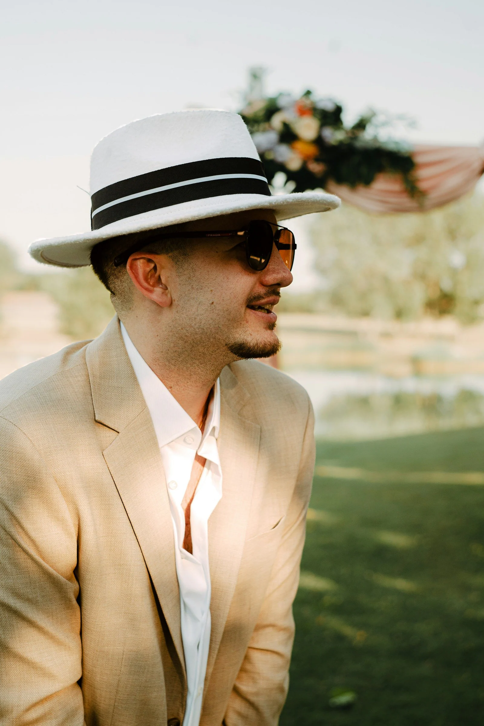 Beige summer suit with a straw fedora
