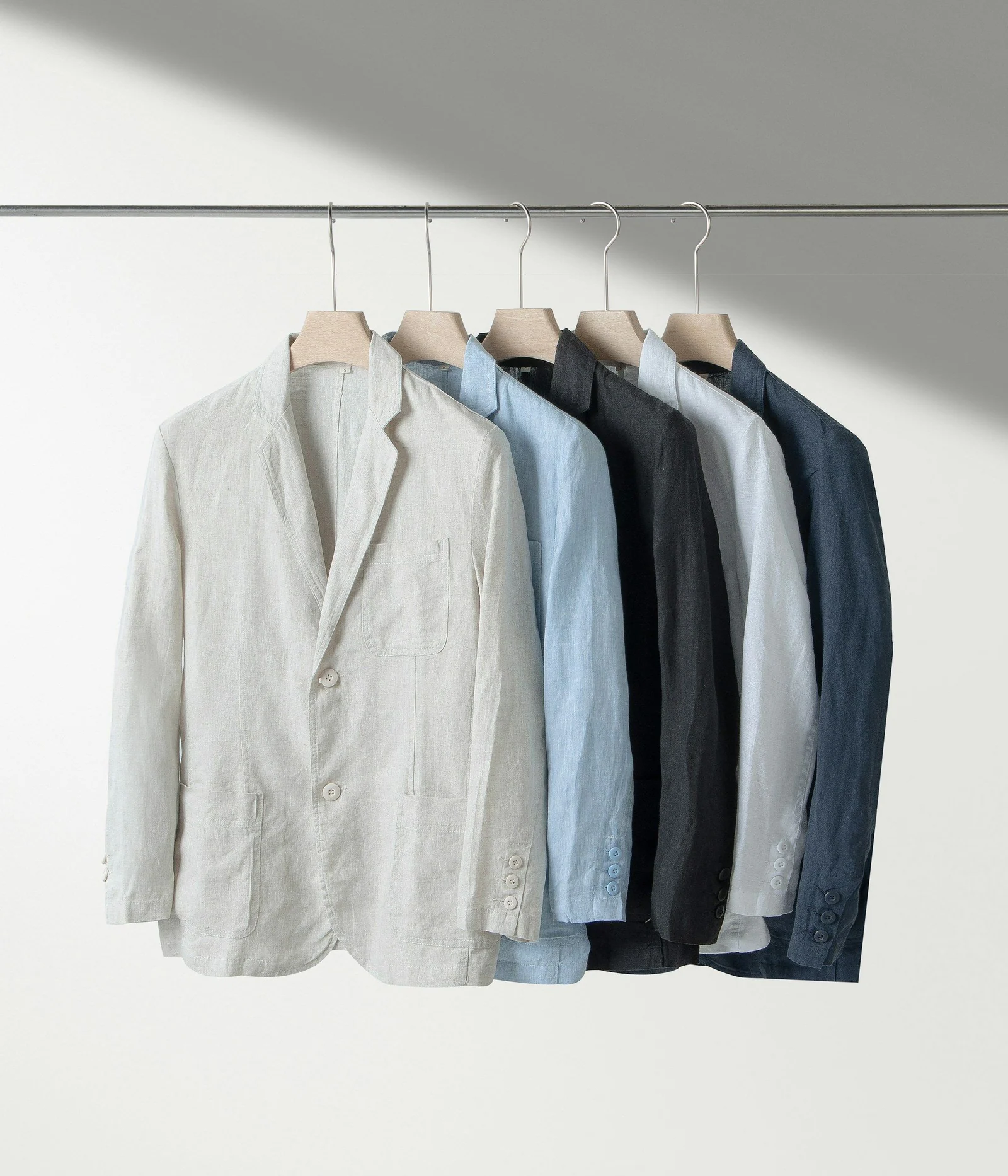 Lightweight summer jackets on a rail